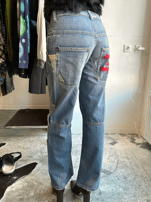 jeans with red embroidery on back pocket