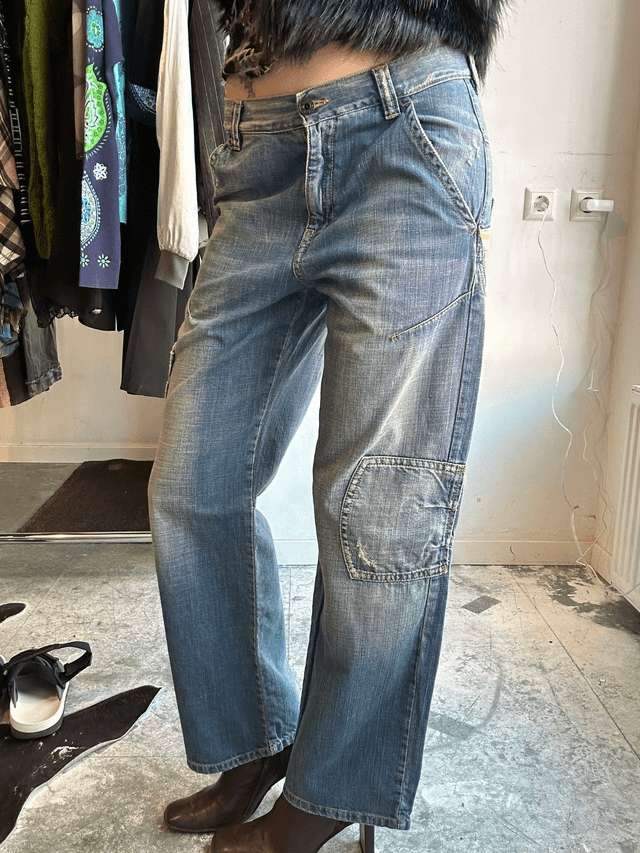 jeans with red embroidery on back pocket