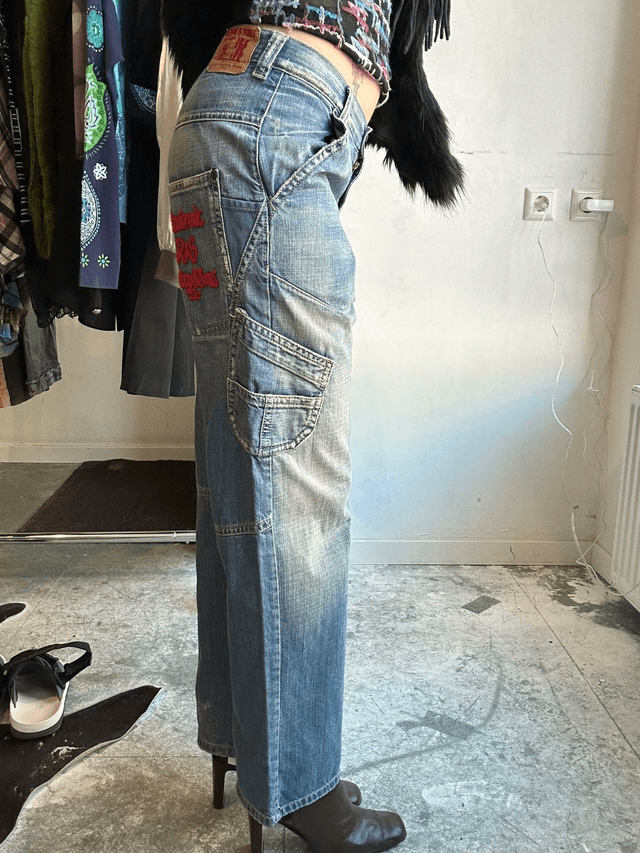 jeans with red embroidery on back pocket